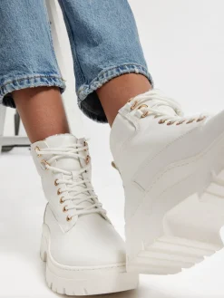 White Lace Up Ankle Boot with Embossed Monogram Detail